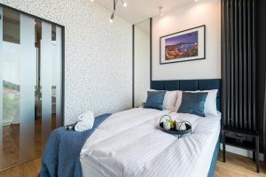 Posteľ alebo postele v izbe v ubytovaní Q18 ApartHotel