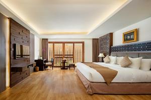 Кровать или кровати в номере Villa Kayu Raja
