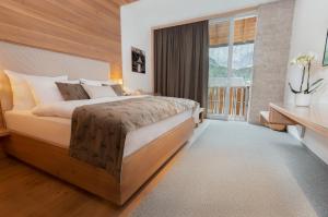 Voodi või voodid majutusasutuse Boutique Skipass Superior Hotel toas