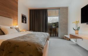 Voodi või voodid majutusasutuse Boutique Skipass Superior Hotel toas