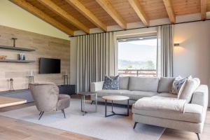 Televízia a/alebo spoločenská miestnosť v ubytovaní Chalet 149 Westendorf by ALPS RESORTS