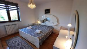 Postel nebo postele na pokoji v ubytování Apartma Bajc + 37 fotografií
