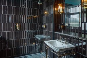 a bathroom with a sink and a mirror at No17 The Promenade in Oban