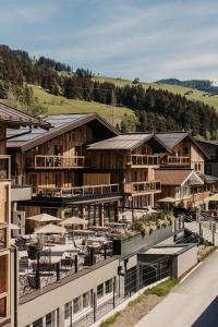 an aerial view of a resort with buildings at Hofgut Apartment & Lifestyle Resort Wagrain in Wagrain