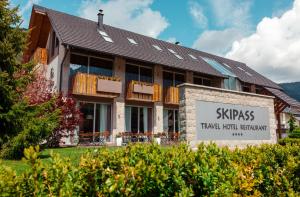 a building with a sign in front of it at Boutique Skipass Superior Hotel in Kranjska Gora