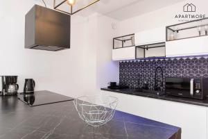 Kuchyňa alebo kuchynka v ubytovaní City Center - Torunska 18 by Apartmore