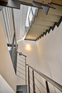 a staircase in a building with white walls and ceilings at Simone Cenedese Murano Apartments - Ambra in Venice