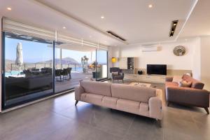 A television and/or entertainment centre at Luxury 5 bedroom villa with heated infinity pool & amazing sea views