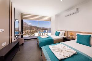 A bed or beds in a room at Luxury 5 bedroom villa with heated infinity pool & amazing sea views