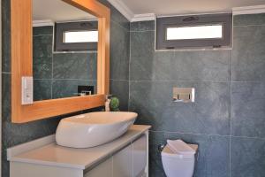 A bathroom at Luxury 5 bedroom villa with heated infinity pool & amazing sea views