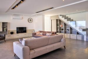 A seating area at Luxury 5 bedroom villa with heated infinity pool & amazing sea views