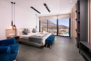 A bed or beds in a room at Luxury 5 bedroom villa with heated infinity pool & amazing sea views