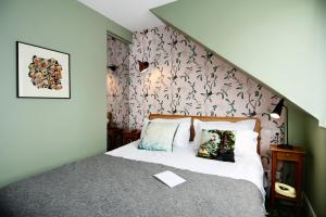 Postel nebo postele na pokoji v ubytování Hotel Les Pilotes