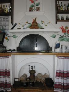 a room with a fireplace in a kitchen at Transit Hotel in Dʼyakovtsy