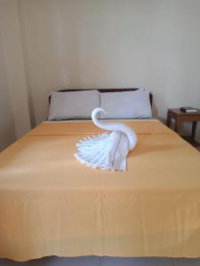 A bed or beds in a room at Villa Almedilla Pension House
