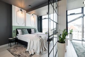 Posteľ alebo postele v izbe v ubytovaní Q18 ApartHotel