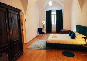 Łóżko lub łóżka w pokoju w obiekcie Franz Haus Apartments