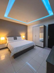 מיטה או מיטות בחדר ב-Waqet AlFakhama Furnished Apartments