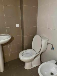 a bathroom with a toilet and a sink at Apto Los Molinos Sotano A REF 049 in Lucena del Cid