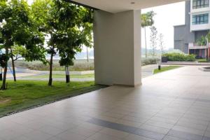 an empty courtyard with trees and a building at Conezion 3-bedroom condo @ IOI City Mall Putrajaya in Serdang