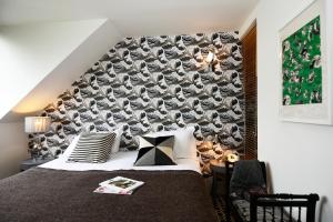 Postel nebo postele na pokoji v ubytování Hotel Les Pilotes