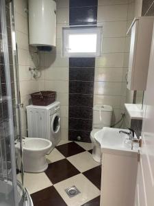 a bathroom with a toilet and a sink at Villa Nilić in Bar