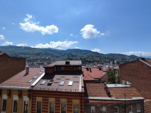 a view of the roofs of buildings in a city at Deluxe Apartment Lejla - Free garage parking in Sarajevo