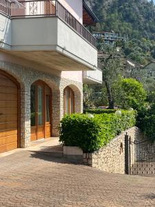 a building with a balcony on the side of it at Villa Gianna in Limone sul Garda