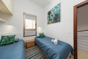 Ein Bett oder Betten in einem Zimmer der Unterkunft MEDANO4YOU The Ocean House