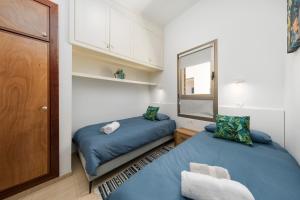 Ein Bett oder Betten in einem Zimmer der Unterkunft MEDANO4YOU The Ocean House