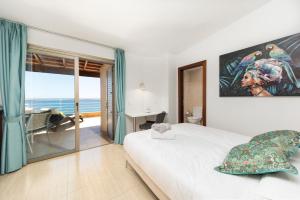 Ein Bett oder Betten in einem Zimmer der Unterkunft MEDANO4YOU The Ocean House