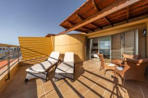 Ein Balkon oder eine Terrasse in der Unterkunft MEDANO4YOU The Ocean House
