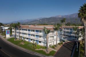 an aerial view of a building with palm trees at Motel 6-Carpinteria, CA - Santa Barbara - North in Carpinteria