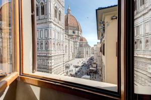 a view of a city from a window at Hotel Bigallo in Florence