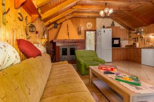 a living room with a couch and a table at Vila Tea in Novi Vinodolski