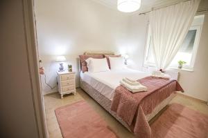 A bed or beds in a room at Stefania's Home