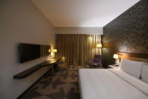 เตียงในห้องที่ Radisson Blu Hotel, Abidjan Airport