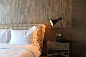 เตียงในห้องที่ Radisson Blu Hotel, Abidjan Airport
