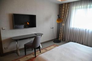 โทรทัศน์และ/หรือระบบความบันเทิงของ Radisson Blu Hotel, Abidjan Airport