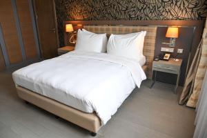 เตียงในห้องที่ Radisson Blu Hotel, Abidjan Airport