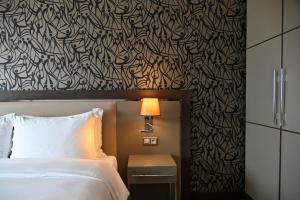 เตียงในห้องที่ Radisson Blu Hotel, Abidjan Airport