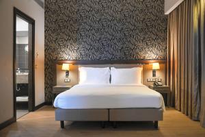 เตียงในห้องที่ Radisson Blu Hotel, Abidjan Airport