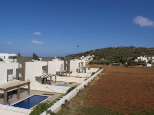 an aerial view of a building with a swimming pool at The Anemoni 5 Villa in Protaras