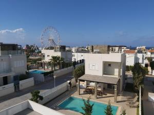 an aerial view of a city with a ferris wheel at The Anemoni 5 Villa in Protaras