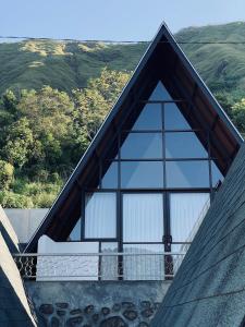 a large window on the roof of a house at Bukit Tiga Lima Boutique Hotel in Sajang