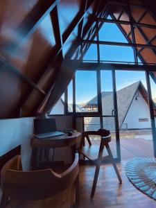 a room with a desk and a laptop on a table at Bukit Tiga Lima Boutique Hotel in Sajang