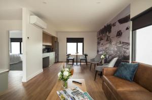 a living room with a couch and a table at Berri Hotel in Berri