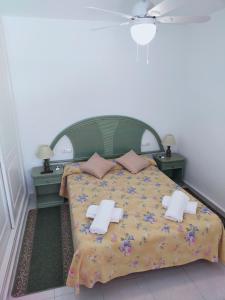 מיטה או מיטות בחדר ב-EL DESCANSO