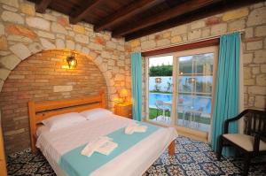 Postel nebo postele na pokoji v ubytování Cesme Elysium Hotel