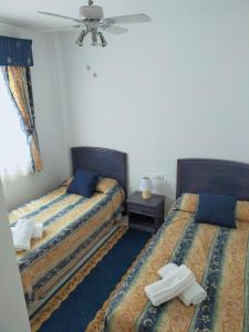 מיטה או מיטות בחדר ב-EL DESCANSO